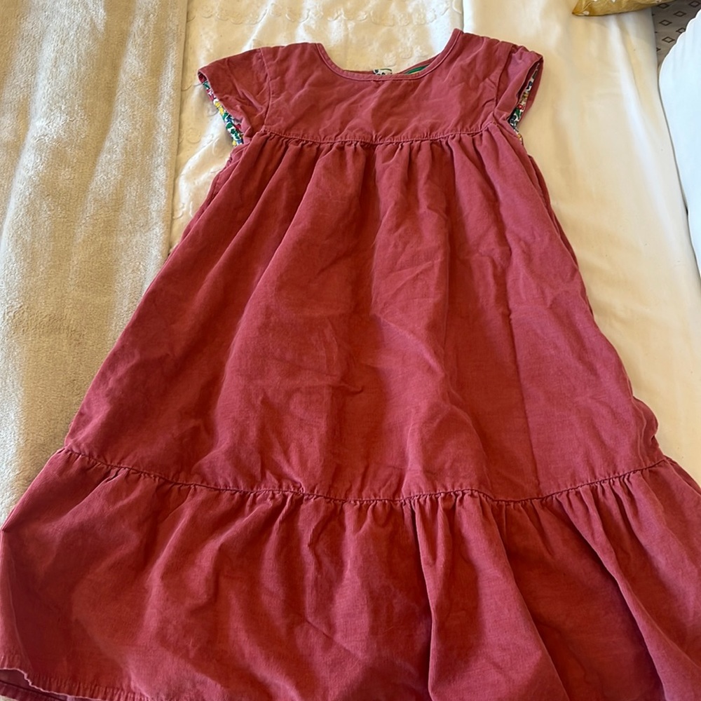 This is a kids mini Boden corduroy pink dress.